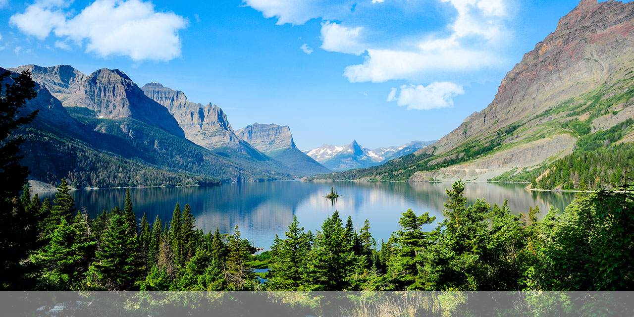Mountains around a lake with trees