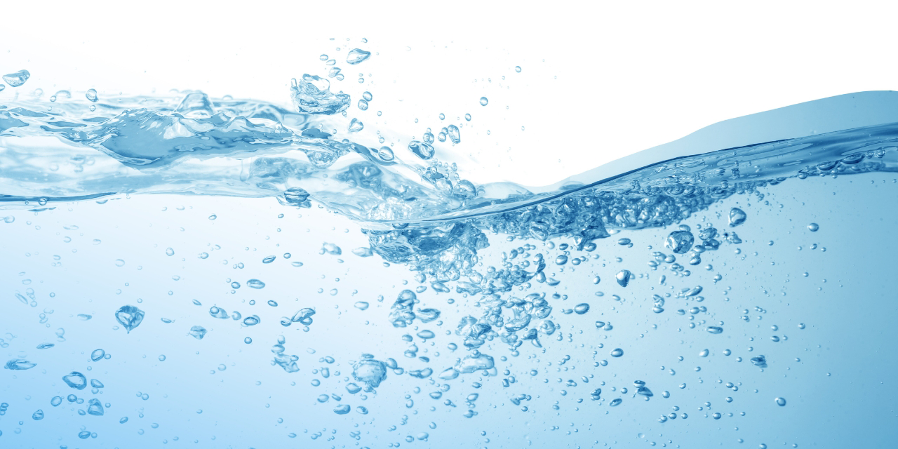 Wave of water wtih bubbles.