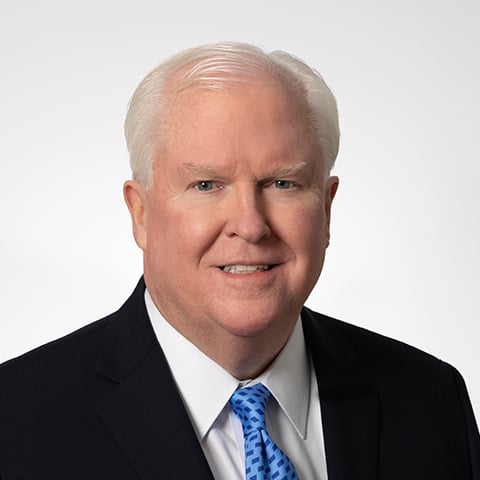 Jim Allen professional headshot with gray background.