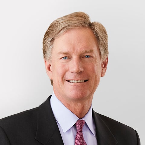 Steve Booth professional headshot with gray background.