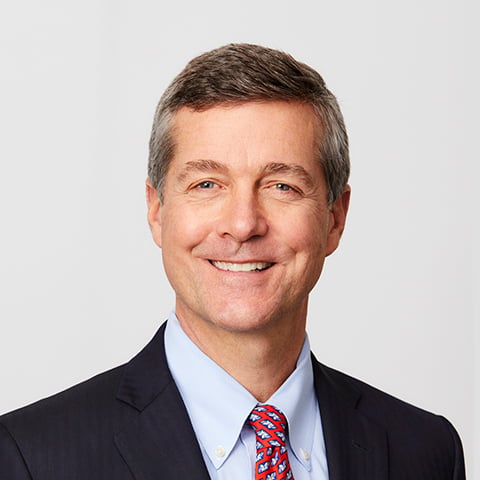 Michael Schroeder professional headshot with gray background.