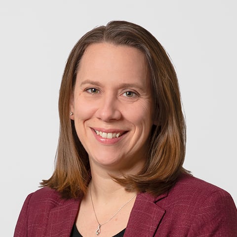 Laura Thurow professional headshot with gray background.