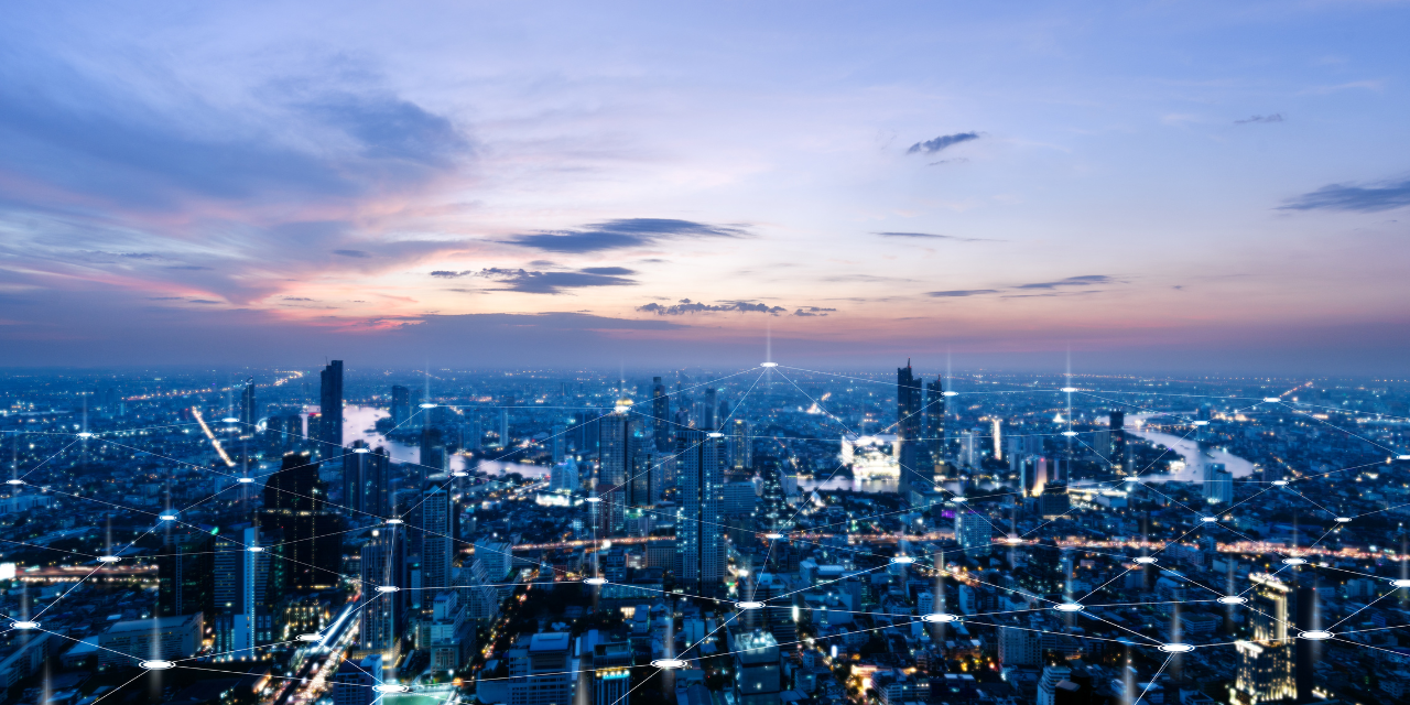 Skyline at dusk with an overlay of digital connections