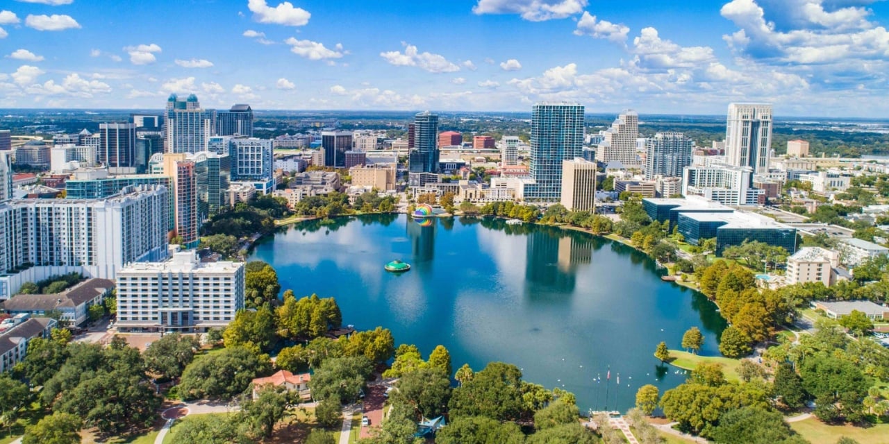Arial view of a city surrounding a body of water.